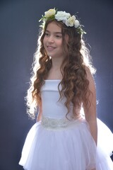 High resolution close up studio portrait of a single beautiful 12 year old Caucasian girl in a...