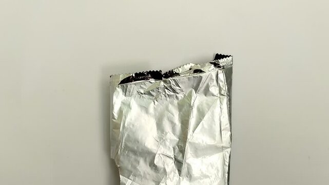 Multilayer plastic on white background. Multilayer plastic is very commonly used in various products, especially those that require long shelf life and optimal protection.