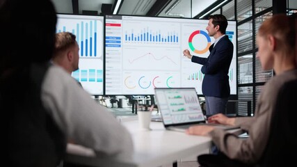 Team Meeting In Office To Analyze Data - Powered by Adobe