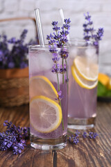  A glass of homemade lavender lemonade. Garnished with lemon wedges and lavender sprigs