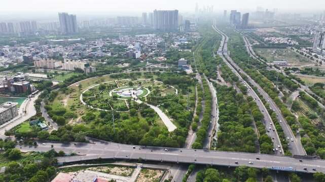 Aerial drone shot capturing roadways surrounded by residential complexes in Noida.