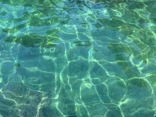 Amazing sea surface emerald water.