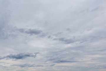 Overcast sky with scattered gray clouds