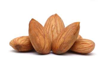 A close-up group of raw, whole, shelled almond nuts isolated on a clean white background.