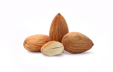 A group of whole and one half-cut raw almond, a healthy snack isolated on white.