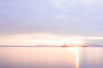 Tranquil Sunrise over Lake Biwa with Floating Structure and Soft Reflections