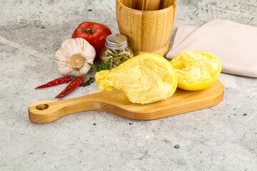 Italian traditional yellow Scamorza cheese