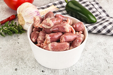 Fresh raw chicken hearts in the bowl