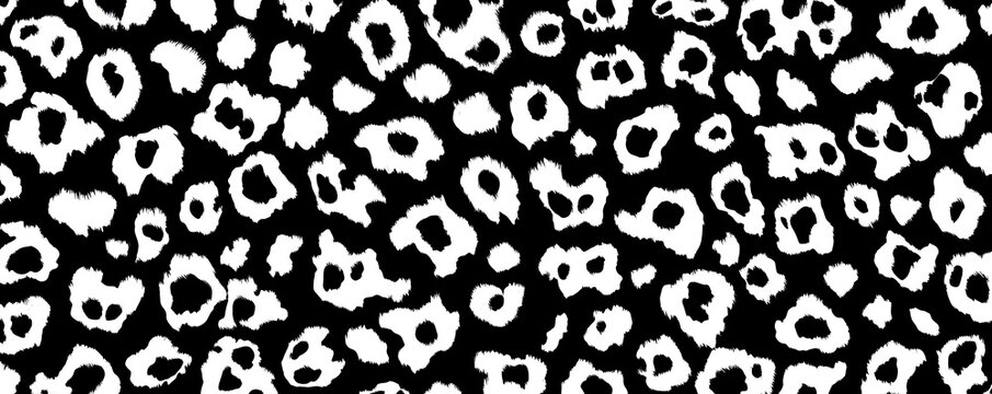 Repeating leopard print pattern with bold black spots over a white and gray fur textured background in a modern and graphic seamless style for textiles