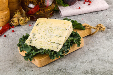 Blue cheese piece over board