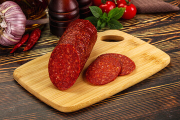 Spicy pepperoni sausages with sliced piece