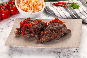 Baked beef cheeks with vegetables