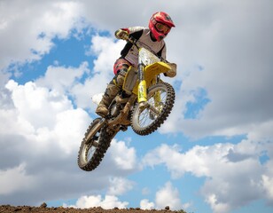 yellow motocross bike in the air