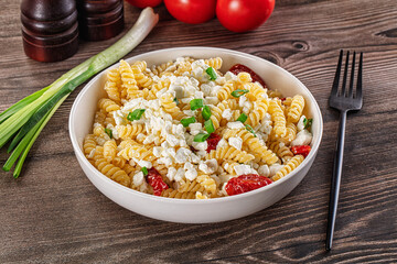 Italian pasta fusili with curd