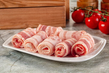 Raw bacon pork roll sliced