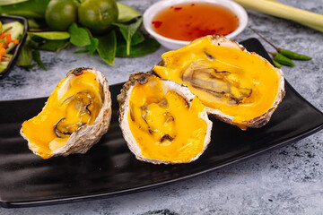 Baked oyster with cheddar cheese