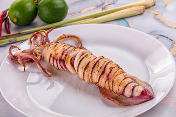 Tasty grilled wild squid with lime