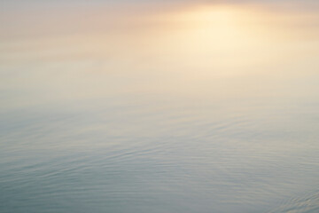 Soft Gradient Water Surface at Sunrise