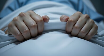 Cold Hands Gripping Sheet in Hospital Scene