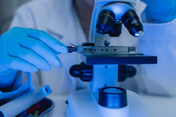 two scientists are working together to find a new antiviral drug, two chemists are using scientific...