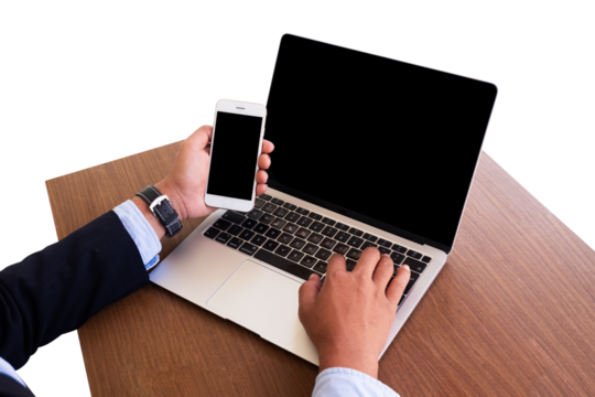 businessman working on laptop and using a phone