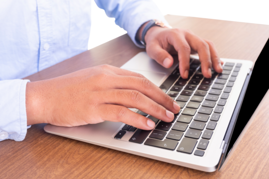 businessman typing on a laptop