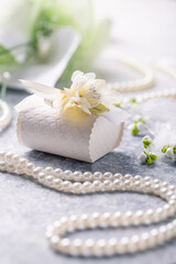 Wedding still life with pearl necklace and bouquet