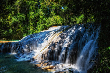Close up of a cascade of the Agua Azul waterfalls in the rainforest of Chiapas, Palenque, Mexico.