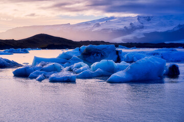 Jokulsarlon glacier lagoon in sunset skyline and sun light background, travel in Iceland