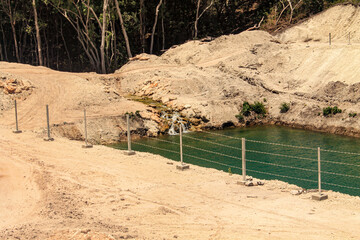 In the rock-strewn savanna under scorching, grass-parching heat, a hidden water source flows...