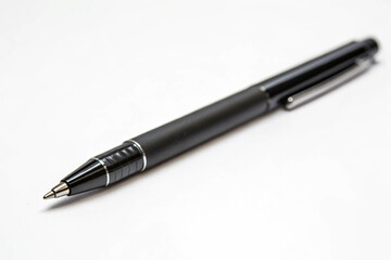 Modern black pen, featuring gleaming silver trim, positioned on a pristine white desk, for business.