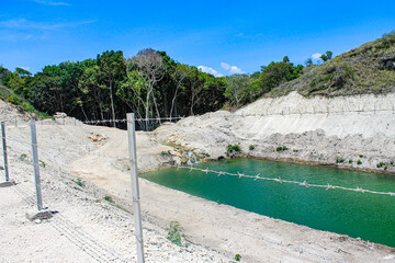In the rock-strewn savanna under scorching, grass-parching heat, a hidden water source flows...
