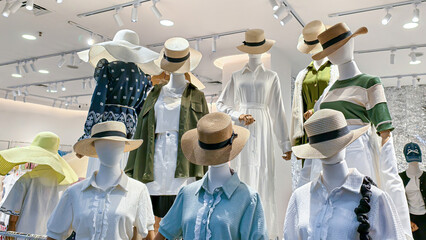 Stylish mannequin collection showcasing diverse summer hats and clothing designs for retail display