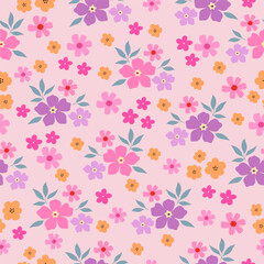 Seamless pattern with pink, purple and yellow flower blossom garden on pink background. Cute hand drawn floral pattern for your fabric, summer background, wallpaper, textile.