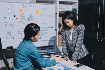 Group of young application developers analyzing uxui mobile app templates during a working meeting