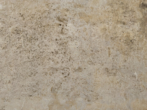 Rustic Stone Surface with Authentic Weathered Texture and Earth-Toned Patterns