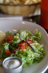 Close up of vegetables salad on white plate