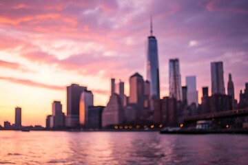 Fototapeta premium Blurred city skyline at sunrise with pastel colors background