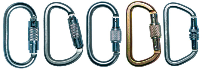 Isolated collection of climbing steel carabiners on white background