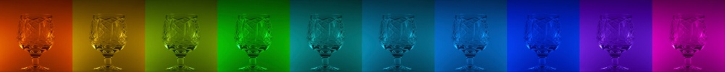 Collection of crystal glass on colored background