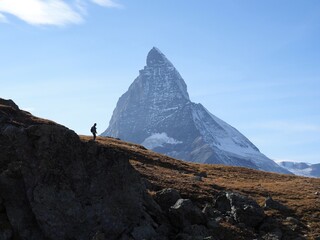 Silhouette of hiker against Matterhorn mountain in Zermatt, Switzerland