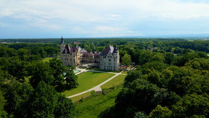 Moszna Castle fly over landscape view from above architecture near the village Moszna Poland