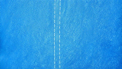 sky Blue jeans background with double stitching. Close-up. Copy space. Denim texture. The border of the seams. 