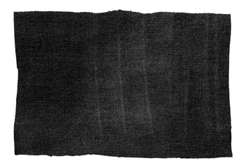 Piece of black torn denim on a white background. Denim texture