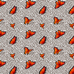Red butterflies on a spotted background.Vector seamless pattern with red butterflies on a colored spotted background.