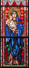 Selbstklebende Fototapeten PIACENZA, ITALY - MAY 20, 2025: The  Madonna on the stained glass in church Basilica di San Francesco by Franz Xaver Zettler from year 1889. © Renáta Sedmáková