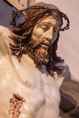 Selbstklebende Fototapeten PIACENZA, ITALY - MAY 20, 2025: The detail of renaissance carved Crucifixioinin the Church Basilica di San Francesco by Giovanni Angelo Del Maino from 15. cent. © Renáta Sedmáková
