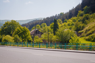 house by the road mountains forest