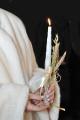 Burning candle with ears of wheat as a memory of the genocide in Ukraine(1932-1933). Holodomor.
