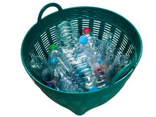 A green plastic basket filled with various empty, crushed plastic water bottles with colorful caps.